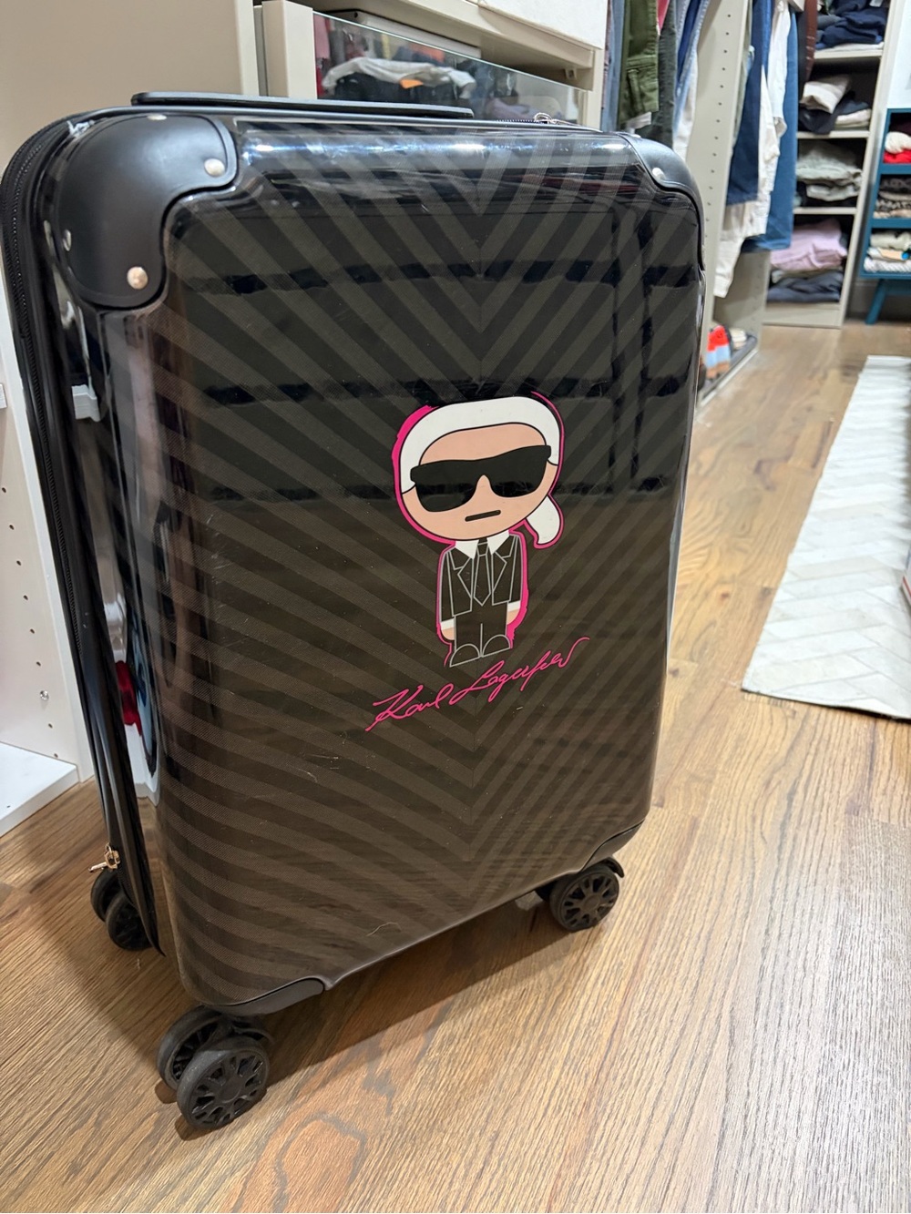 Karl Lagerfeld Black Glossy Spinner Suitcase with Pink Accents